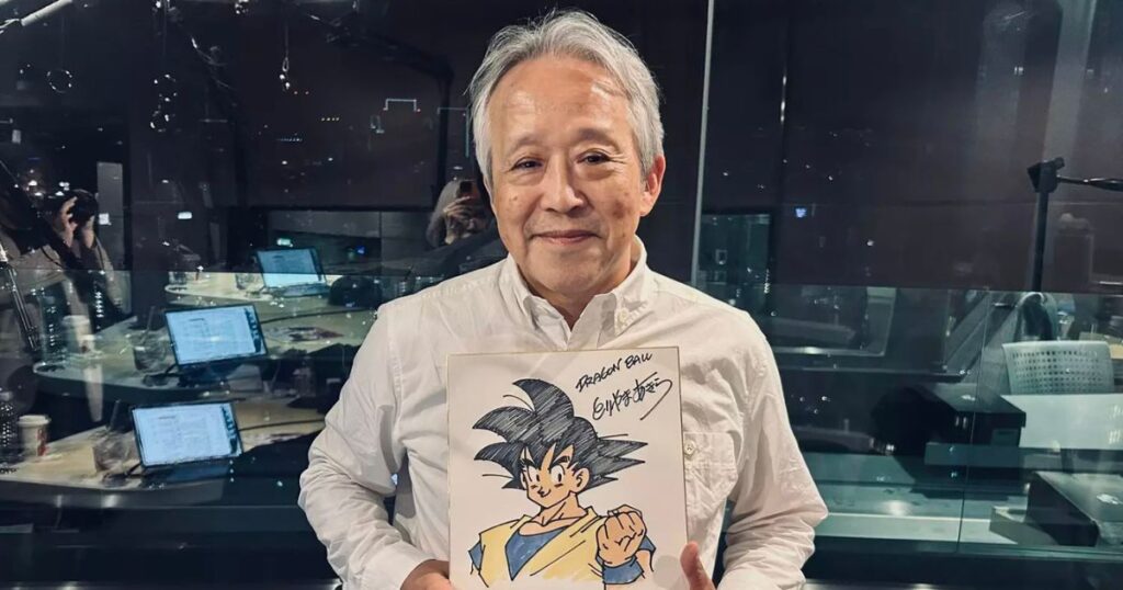 Former Dragon Ball editor Kazuhiko Torishima with Akira Toriyama's Goku artwork during an interview about modern anime trends.