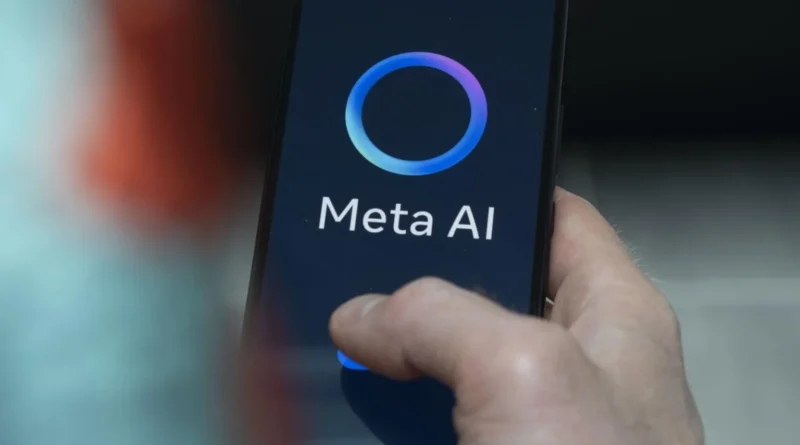 A close-up of a person holding a smartphone displaying the Meta AI interface, featuring a glowing circular logo and the text "Meta AI" on the dark screen.