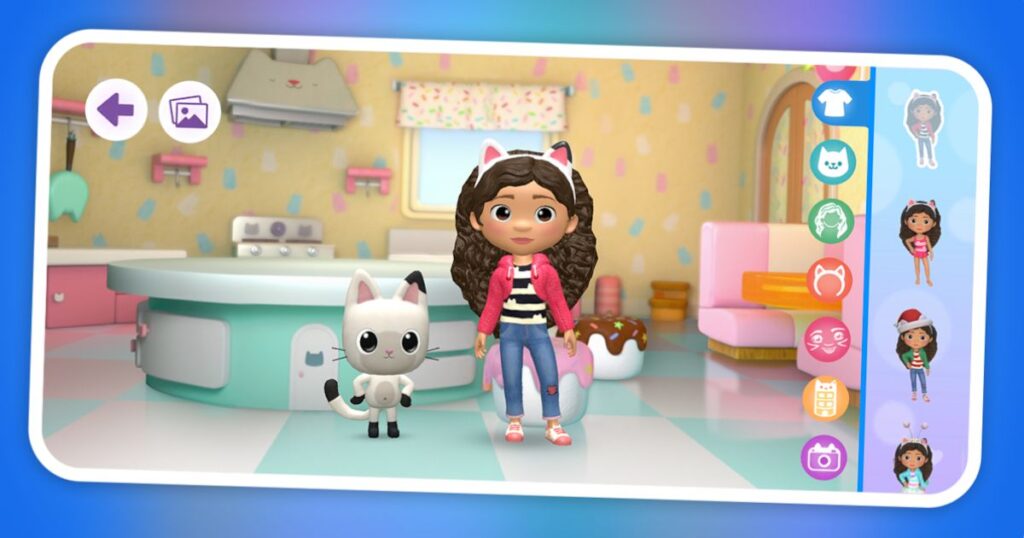 An in-game screenshot showing a cartoon girl character with a cat ear headband and a pink jacket standing in a bright, colorful kitchen next to a cartoon cat character, with an outfit selection menu on the right side.