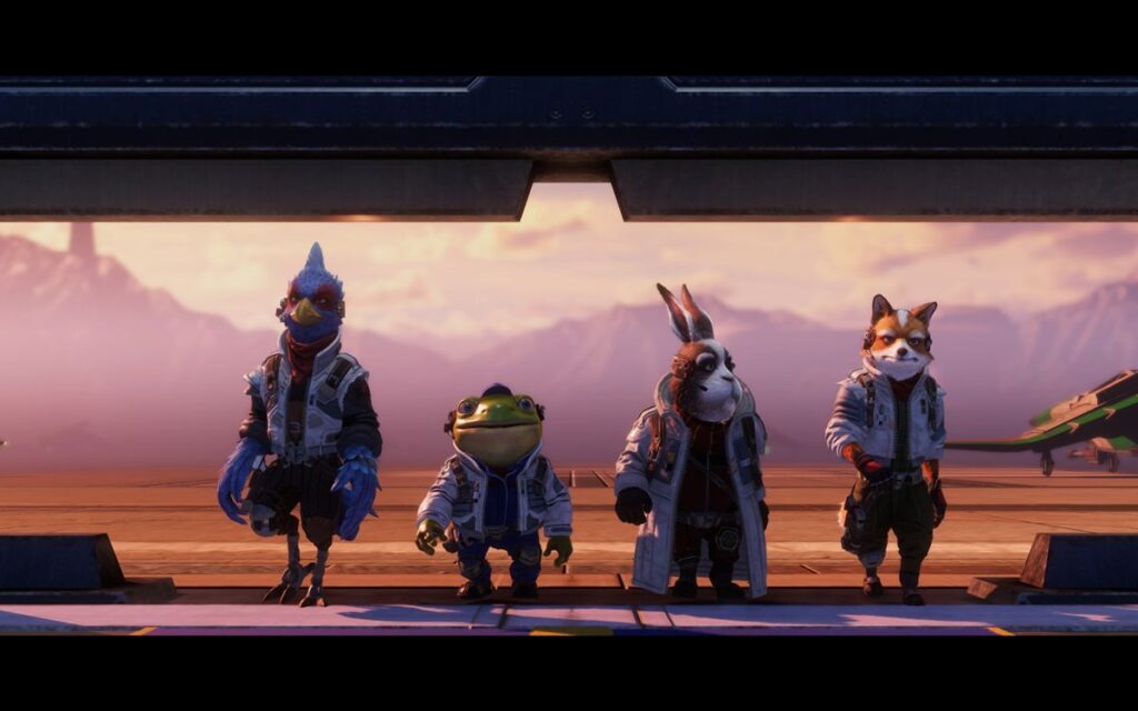The Star Fox team (Falco, Slippy, Peppy, and Fox) walking forward in a low-lit hangar against a mountain backdrop during sunset.